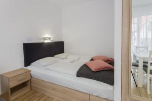 Łóżko lub łóżka w pokoju w obiekcie K2 Apartamenty