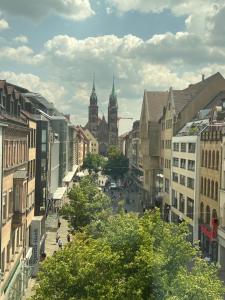 a view of a city street with buildings at NB Apartments in Nürnberg