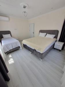 Postel nebo postele na pokoji v ubytování CEM OTEL