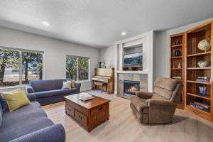 a living room with two couches and a piano at Edro Place in Bend