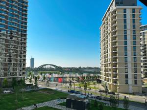 a view of a city with two tall buildings at SuprStay - Belgrade Waterfront Luxury Studio in Belgrade
