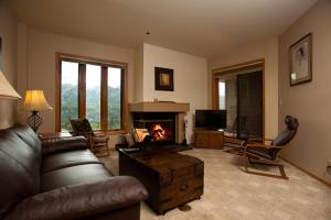 a living room with a couch and a fireplace at Kendall 444 in Durango Mountain Resort