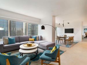 a living room with a couch and a table at Swissotel Chicago in Chicago