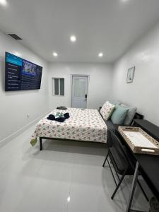 Säng eller sängar i ett rum på Casa West Miami