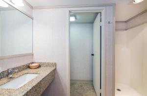 a bathroom with a sink and a mirror at Mountainside Inn 417 by Alpine Lodging Telluride in Telluride