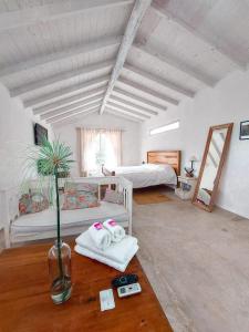 a room with two beds and towels on a table at Casa Tenis Hotel & Club in Benavídez