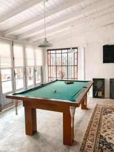 a large room with a pool table in it at Casa Tenis Hotel & Club in Benavídez