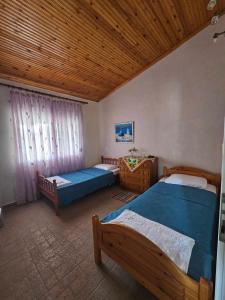 Ένα ή περισσότερα κρεβάτια σε δωμάτιο στο Spyros comfy and cool place +36 φωτογραφίες