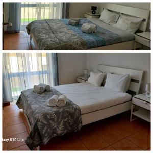 a bedroom with two beds with towels on them at Sol da Foz in Foz do Arelho