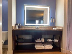 a bathroom with a sink and a mirror at Hotel Solares in Santa Cruz