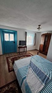 Postel nebo postele na pokoji v ubytování Pensiunea Casa Golovita