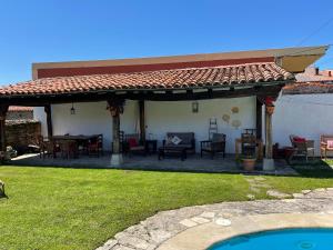 a patio with a pavilion with a table and chairs at Posada Venta Hornizo in Arenas de Iguña