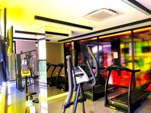 a gym with several tread machines in a room at Studio APaulistana56 in Sao Paulo