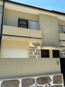 a balcony of a house with a building at House Real Companhia in Vila Nova de Gaia
