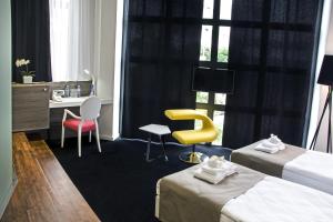 Postel nebo postele na pokoji v ubytování Garni Hotel Eter