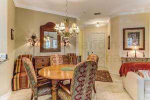 a dining room with a table and chairs at Gated Villas at Summer Beach in Amelia Island