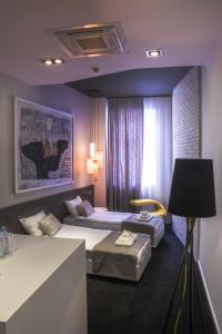 Postel nebo postele na pokoji v ubytování Garni Hotel Eter