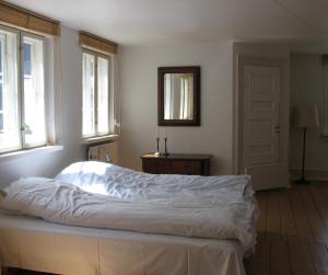 En eller flere senge i et værelse på Thurø Kro B&B