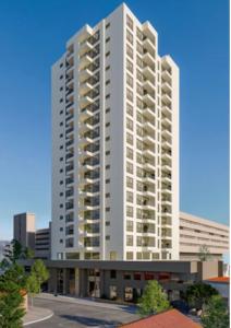 un grand immeuble d'appartements blanc dans l'établissement Apartamento nuevo en Centro de Viña del Mar, Parque Urbano, à Viña del Mar