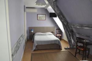 Ένα ή περισσότερα κρεβάτια σε δωμάτιο στο Auberge des Platanes