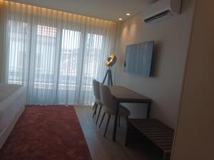 TV a/nebo společenská místnost v ubytování BrandApartments