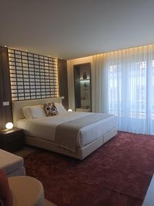 Postel nebo postele na pokoji v ubytování BrandApartments