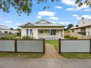 a house with a gate in front of it at The Home Sweet Home in Bairnsdale