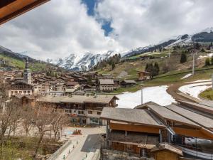 a town in the mountains with snow covered mountains at Appartement La Clusaz, 4 pièces, 8 personnes - FR-1-437-104 in La Clusaz