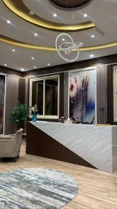 a lobby with a large reception desk in a building at فندق pulse للأجنحة الفندقية in Khamis Mushayt