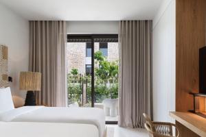 Voodi või voodid majutusasutuse W Costa Navarino toas