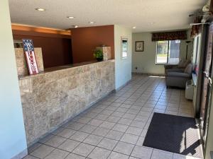 a lobby of a restaurant with a reception counter at Abajo Lodge in Monticello
