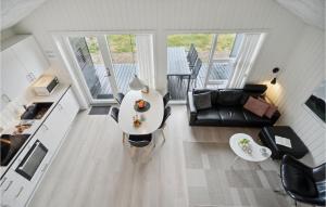 an overhead view of a living room with a couch and a table at Two-Bedroom Holiday Home Ringkøbing 04 in Søndervig