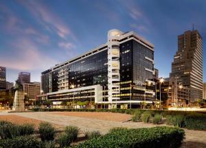 a large building in a city with tall buildings at Onyx Studio Apartment in Cape Town