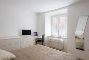 Ένα ή περισσότερα κρεβάτια σε δωμάτιο στο Luxury Appartament Piazza Roma +4 φωτογραφίες