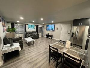 a living room with a couch and a table at Exotic Basement apartment, fully furnished in Provo