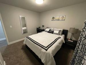 a bedroom with a large bed in a room at Exotic Basement apartment, fully furnished in Provo