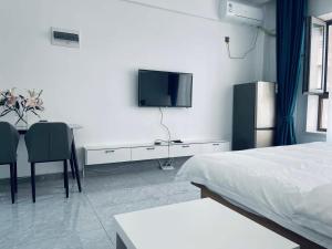 TV i/ili multimedijalni sistem u objektu Utopia Apartment