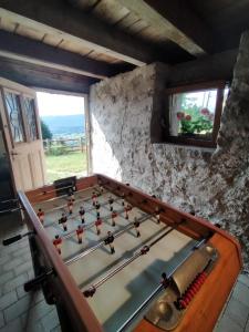 a pool table in the corner of a room at Aux balcons de la vallée in Soultzeren