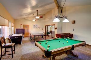 a living room with a pool table and a pool table at Giant Steps 17 Ski In-out in Brian Head