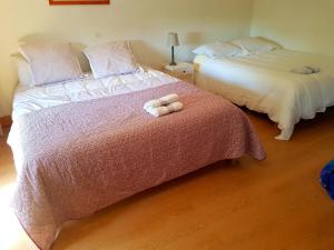 Postel nebo postele na pokoji v ubytování Hameau de Leignoua