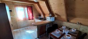Kuchyň nebo kuchyňský kout v ubytování Domki w Rowach + 5 fotografií