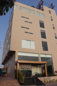 a building with a staircase in front of it at Hotel Kana in Jodhpur