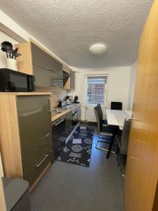 a kitchen and dining room with a table and chairs at Ferienwohnung Elvira in Bad Wildungen