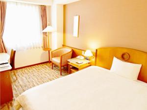 Hotel BELLMARE ホテルベルマーレ客房内的一张或多张床位