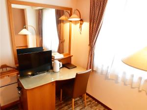 Hotel BELLMARE ホテルベルマーレ的电视和/或娱乐中心