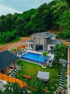 an aerial view of a house with a swimming pool at Kiana Villa in Sapanca
