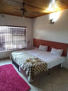 Ένα ή περισσότερα κρεβάτια σε δωμάτιο στο kaste Guest House Randburg