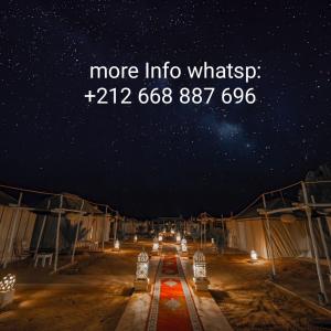 a starry night with the words more into whitt at Ahlam Luxury Camp in Merzouga