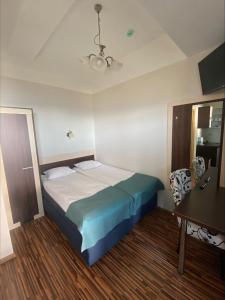 Postel nebo postele na pokoji v ubytování Pirita Beach Apartments & SPA