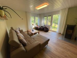 a living room with a couch and a table at s`Lähmes auf der Schwend in Kappelrodeck